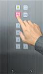 businessman hand press open door button in elevator