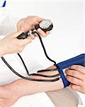 Nurse measuring the blood pressure