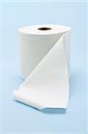 White toilet roll on seamless blue background