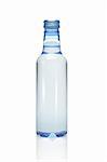 Plastic bottle of mineral water on white background