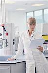 female researcher in chemistry bright labaratory