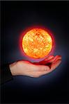 A Glowing floaing above a hand. Sun images provided by NASA.