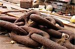 Giant rusty anchor chain in the sea port