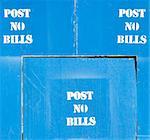 post no bills sign on a blue wall