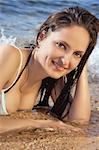 young beautiful girl on the beach in a bikini, portrait close up