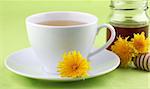 Healthy herbal tea made from freshly picked dandelions with honey