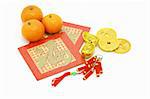 Chinese New Year ornaments, oranges and red packets on white background