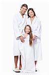 Young family in robes on a white background