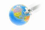 Flying aircraft and jigsaw puzzle globe on white background