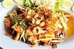 Thai food, deep fried fish with green mango salad
