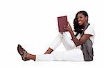 A young African American teenage woman reading a book