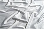 a cut of fabric made of white pure silk