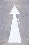 white arrow go to the way . on the road. white arrow