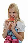 Woman in Dirndl eats Watermelon