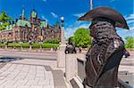 Statue in Confederation Square with Parliament Hill in the distance, Ottawa, Canada.