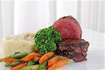 fresh and tasty beef tenderion steak with vegetable in a plate.