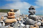 Two stacks of pebble stones on beach