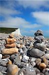 Two stacks of pebble stones on beach