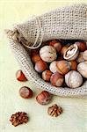 hazelnuts and walnuts in a linen bag