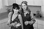 Two middle-aged Caucasian women drink in a retro-style kitchen