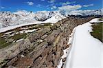 A trench of the first global war near Pagano Peak. 2348 meters on the sea-level, after a spring snowfall. Brixia province, Lombardy region, Italy