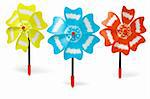 Three colorful toy windmills on white background