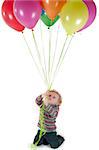 Shot of little cute girl with multicolored air balloons isolated on white