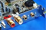 Close up view of a sound card isolated on blue