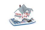 Miniature house with a calculator against a white background