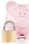Close up of a pink piggy bank and padlock against a white background.