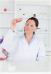 Young scientist looking at a petri dish