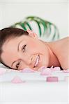 Portrait of a young woman lying on a massage table