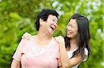 Happy mother talking with her daughter.