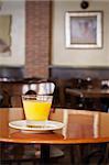 Orange juice served on the bar table