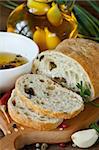 Fresh bread ciabatta and aromatic olive oil with herbs and spices.
