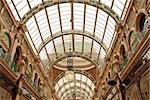 Detail of a  Nineteenth Century Market Arcade with domed Glass Roof Ornate Colourful Ironwork