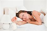 Beautiful woman waking up against a white background