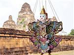 Scenery of puppet at Angkor, Cambodia, with Angkor wat relics as background
