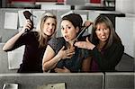 Three women office workers quarrels in cubicle