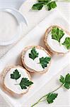 Canape with soft cheese and parsley