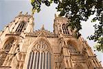 A View of the West Entrance of York Minster Yorkshire England under a blue sky