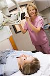 Nurse With Patient Having An X-Ray