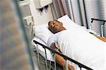 Patient Sleeping In Hospital Bed