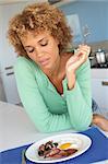 Mid Adult Woman Eating Unhealthy Breakfast