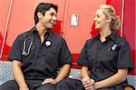 Two paramedics laughing together
