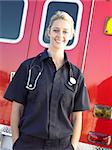 Portrait of paramedic in front of ambulance