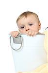 Beautiful baby boy sitting inside a steel bath tub