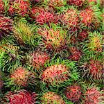 Square background of ripe fruits - rambutan