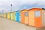 British seafront beach huts on a cloudy day