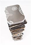 Stack of hard drives with copy space on top in light grey background